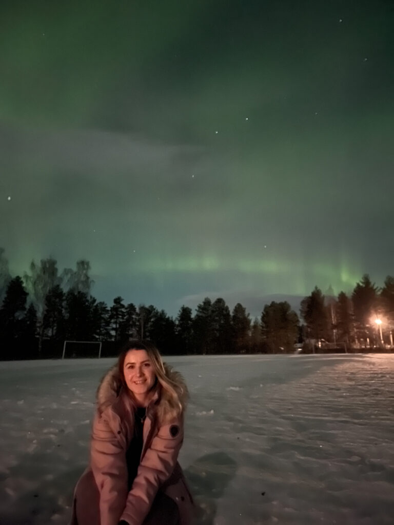 jelena-sitting-in-front-of-northern-lights-arctic-hospitality-manager